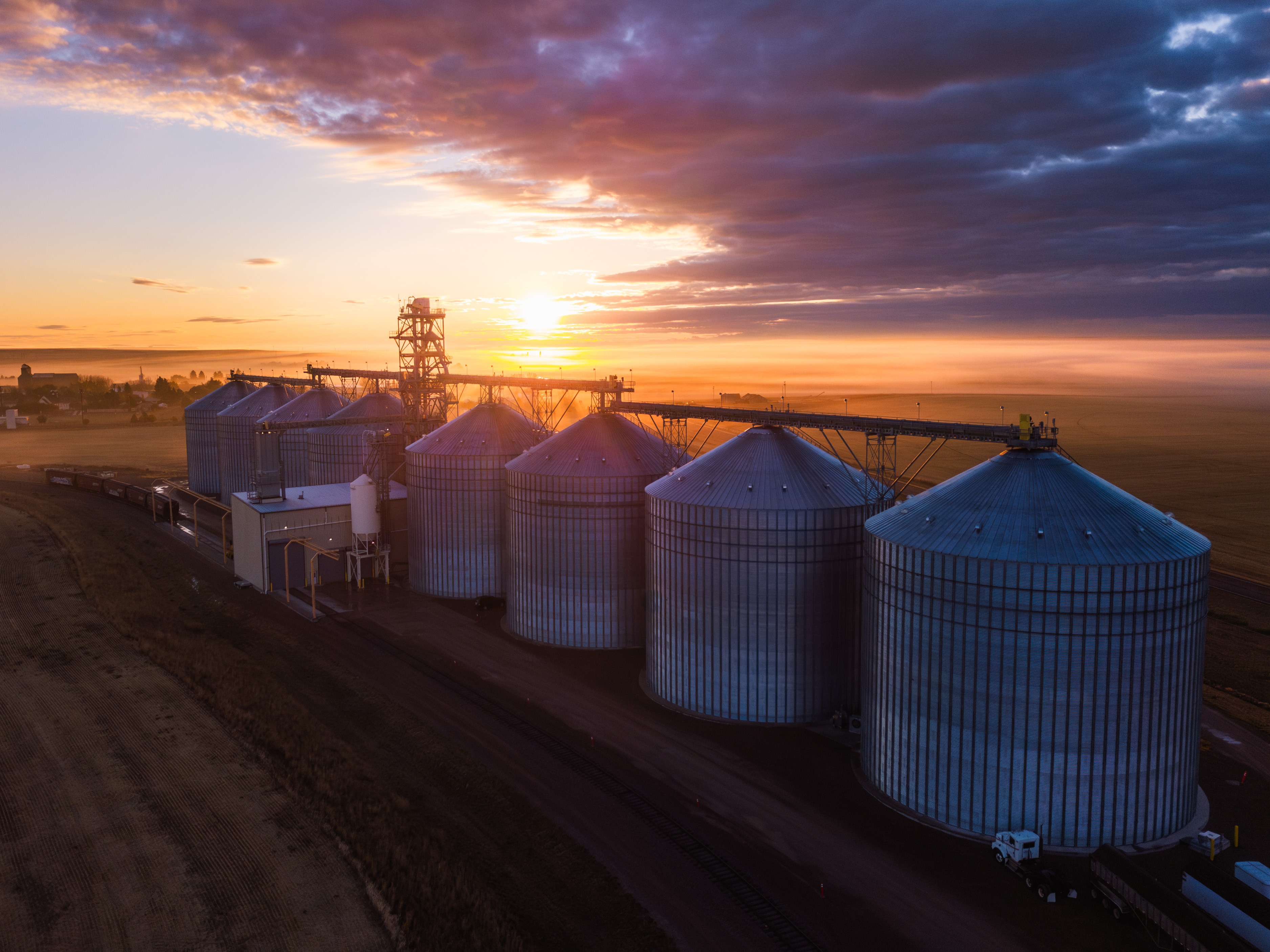 silos with a sunset