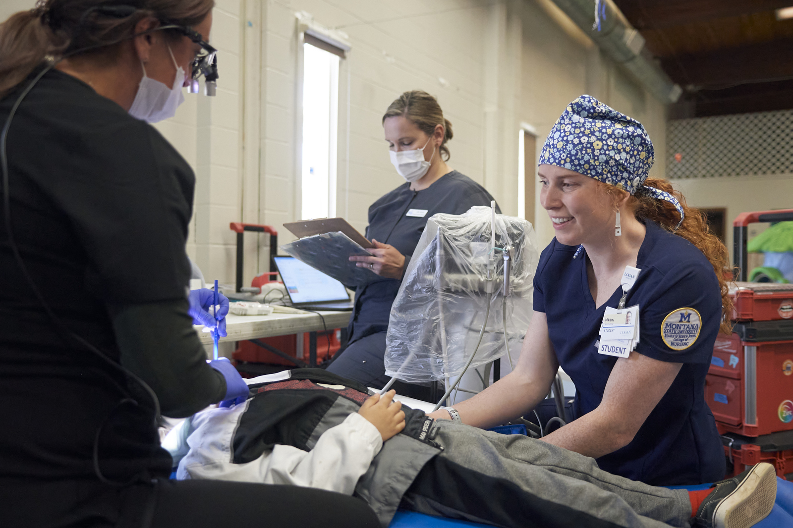 student working with patient